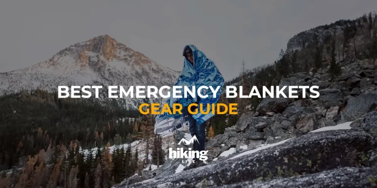Best Emergency Blankets: A hiker on a mountain wrapped in an emergency blanket