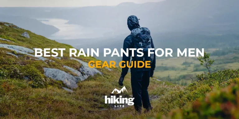 Best Rain Pants for Men: A hiker in rainy conditions walking on a trail in Sweden