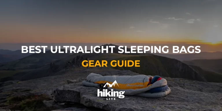Best Ultralight Sleeping Bags: A backpacker sleeps on a mountain top during a scenic sunset