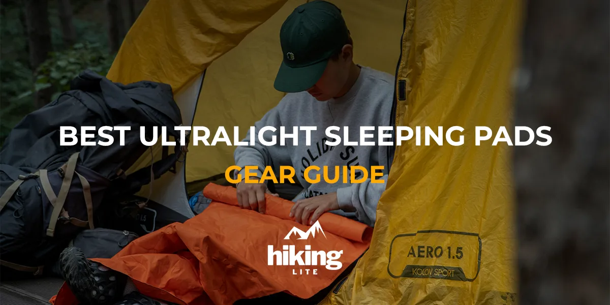 User Best Ultralight Sleeping Pads: A camper rolling up his ultralight sleeping pad in the morning