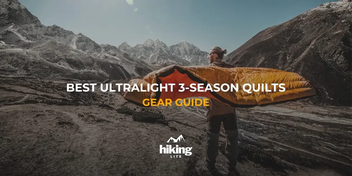 Man in the mountains holding an ultralight 3-season backpacking quilts