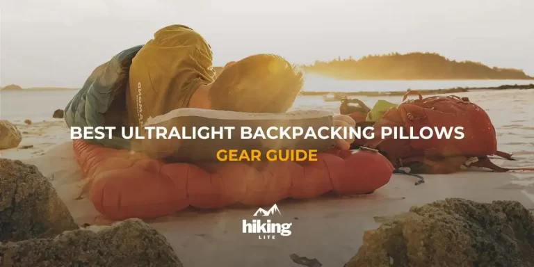 Hiker on the beach during sunset, using a backpacking pillow for head support