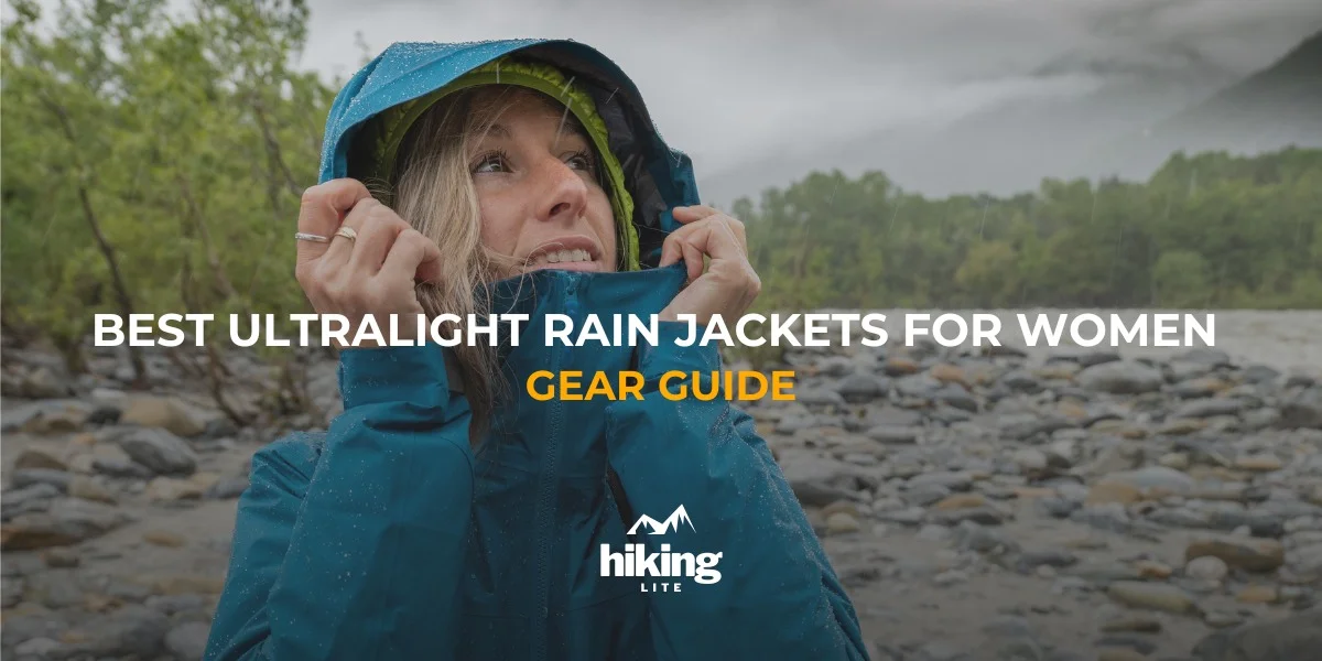 Hiking Rain Jackets: female hiker in the rain, adjusting the hood of her hiking rain jacket