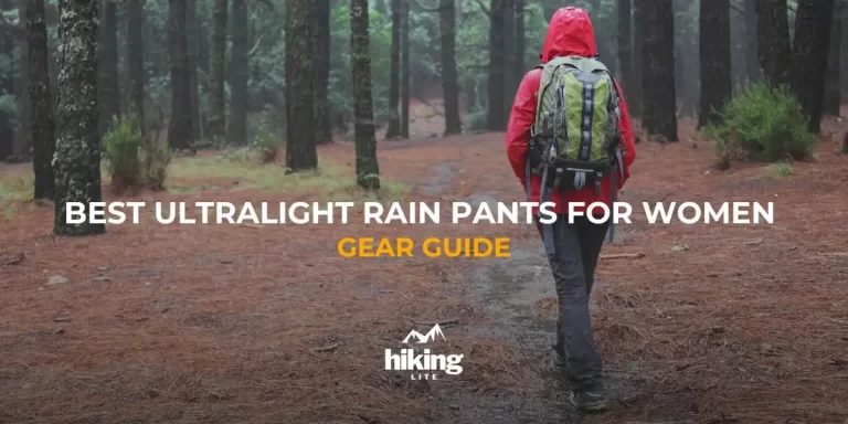 Female hiker in a rainy forest, wearing rain gear including hiking rain pants