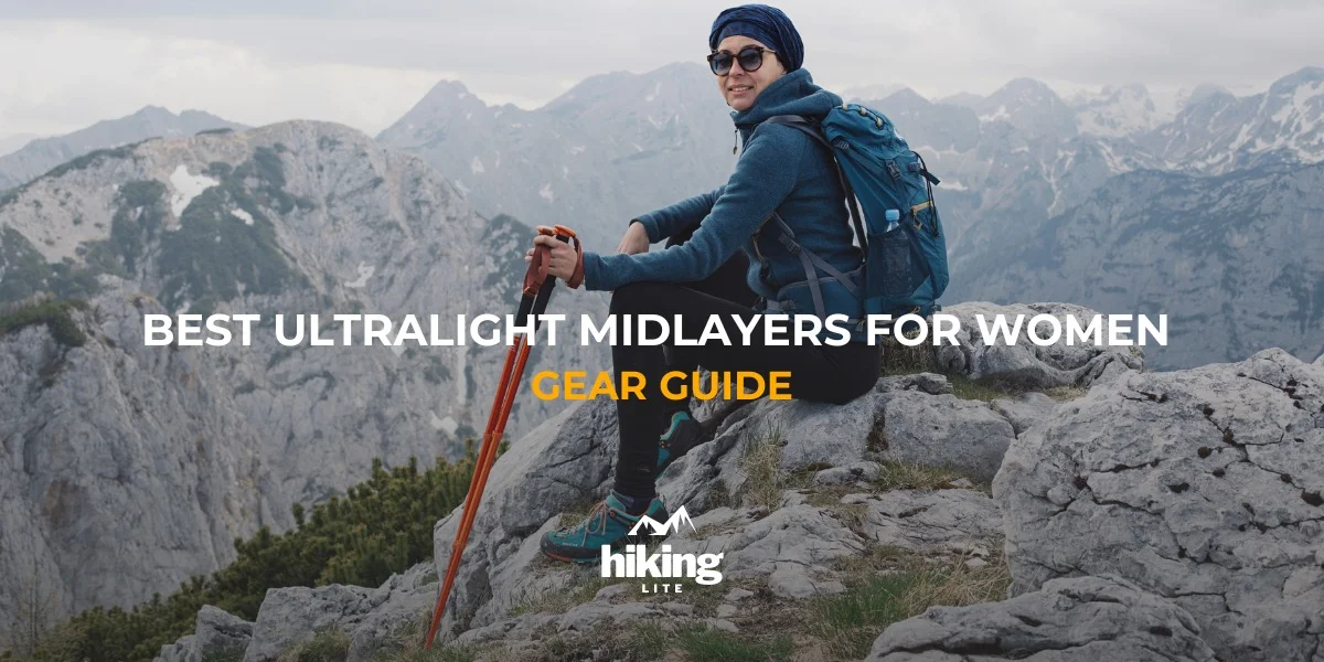 Hiking Midlayers: Mountain hiker with trekking poles in a hiking midlayer