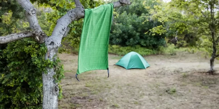 Camping Towels: A neatly hung camping towel at a campsite next to a tent
