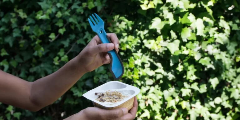 How to Choose Camping Utensils: A close-up of a hiker using a spork
