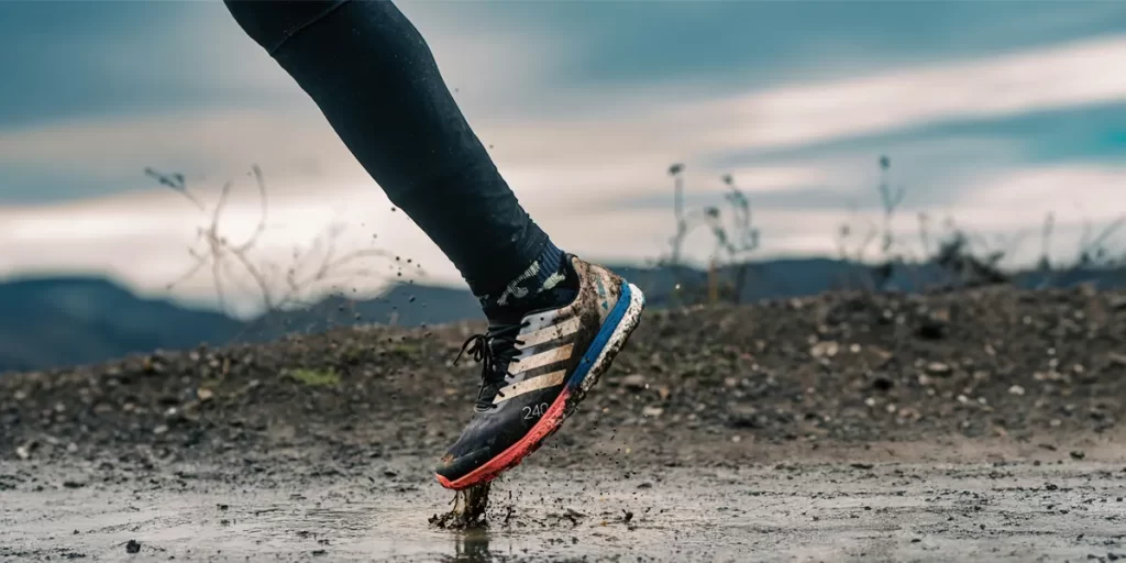 Waterproof Trail Runners: Adidas Terrex being worn on a muddy trail