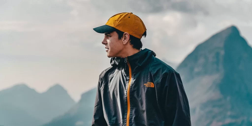 Hiking Jacket: Young hiker wearing a light The North Face jacket
