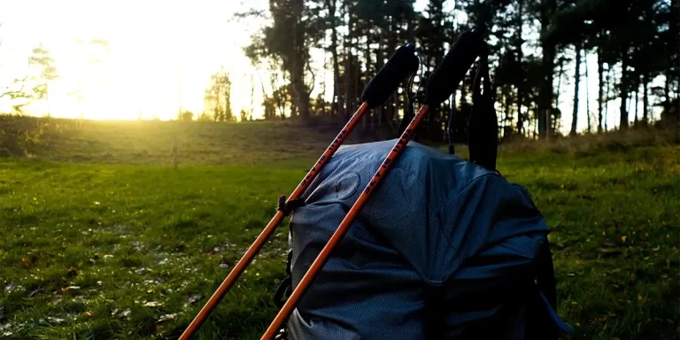Attaching Hiking Poles: Hiking, also known as trekking poles, attached to a backpack