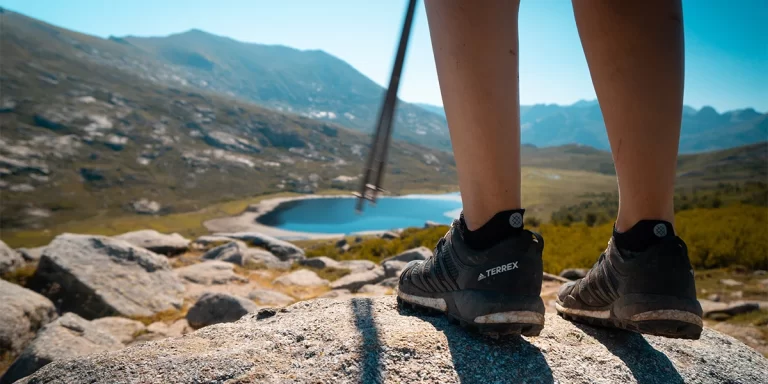 Hiking Toe Socks: A close-up of hikers' feet on a scenic trail