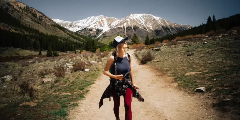 Women's Hiking Hat: Female hiker wearing a baseball cap