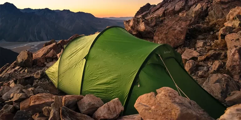 Tent Care: A well-maintained tent in desert mountains during sunset