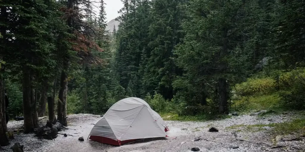 Tarp or Tent: Ultralight MSR tent in the mountains on a rocky ground