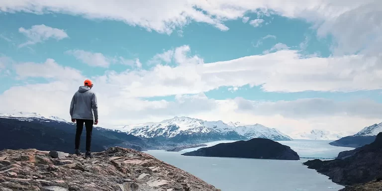 Backpacking in Argentina: a hiker gazing at the mountains in Patagonia