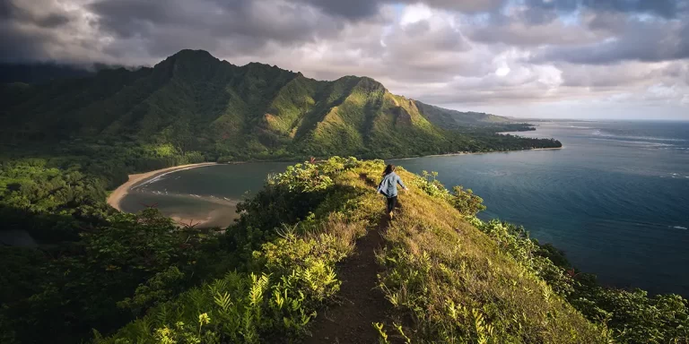 Backpacking in Hawaii: Female hiker roaming a hill in Hawaii