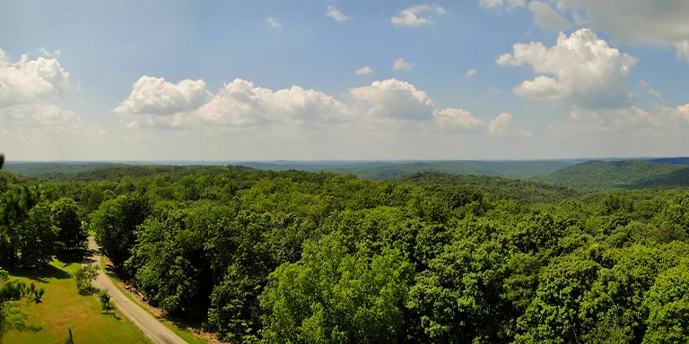 The historic 100-foot (30 m) fire tower at O'Bannon Woods State Park, formerly Wyandotte Woods State Recreation Area, provides a stunning panoramic view of the park and Ohio River valley, once used to keep watch for wildfires in the early days