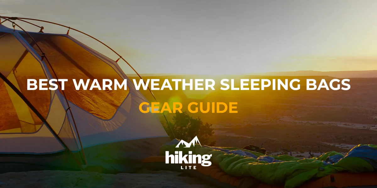 Best Warm Weather Sleeping Bags: Ultralight sleeping bag next to a tent on a hilltop during sunset