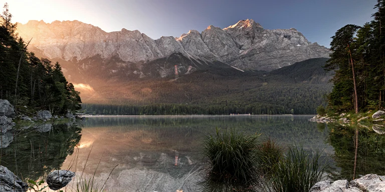 Wonderful morning light bathes the Eibsee with a view of the Zugspitze, known as the Bavarian Caribbean, in Bavaria, Germany